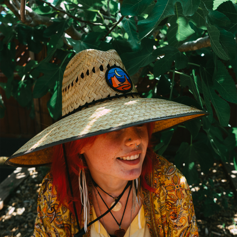 Straw Hat by Tommy Breeze with a person sitting by a fig tree in Marin County