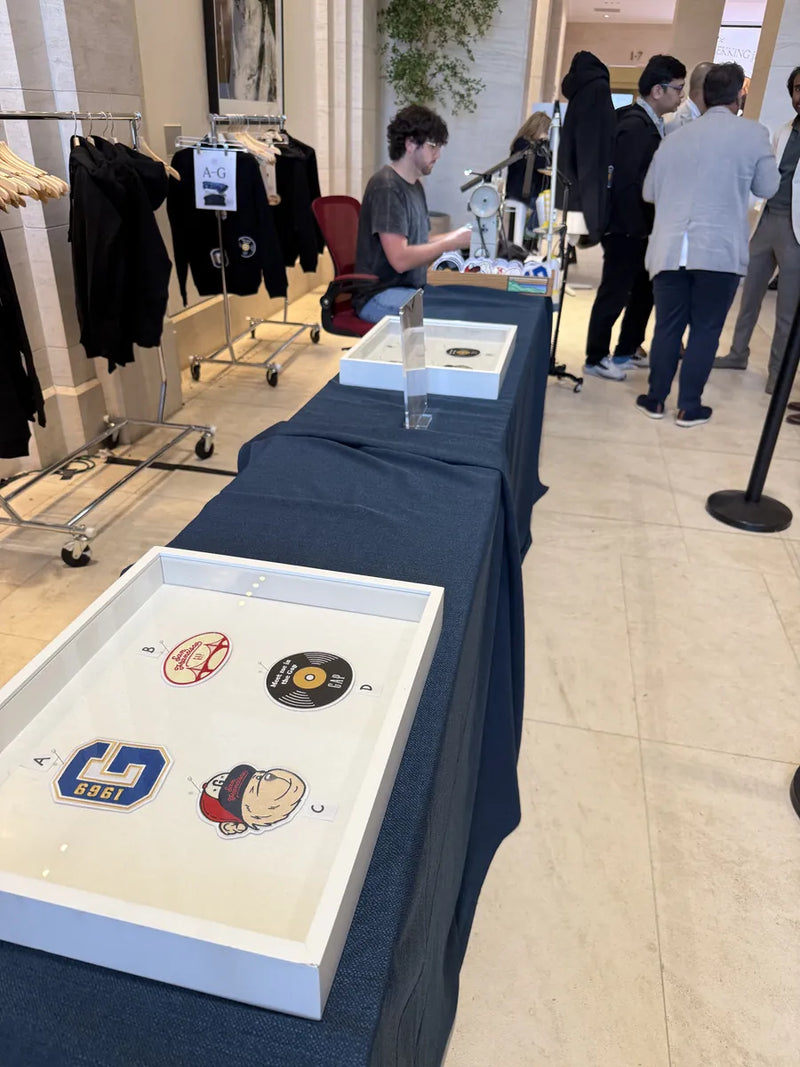 Sewing station and hoodie display set up in a corporate lobby