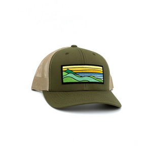 Moss/Sand Trucker hat with  a patch containing a ridgeline