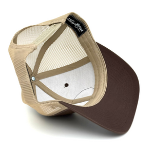 Under brim of hat